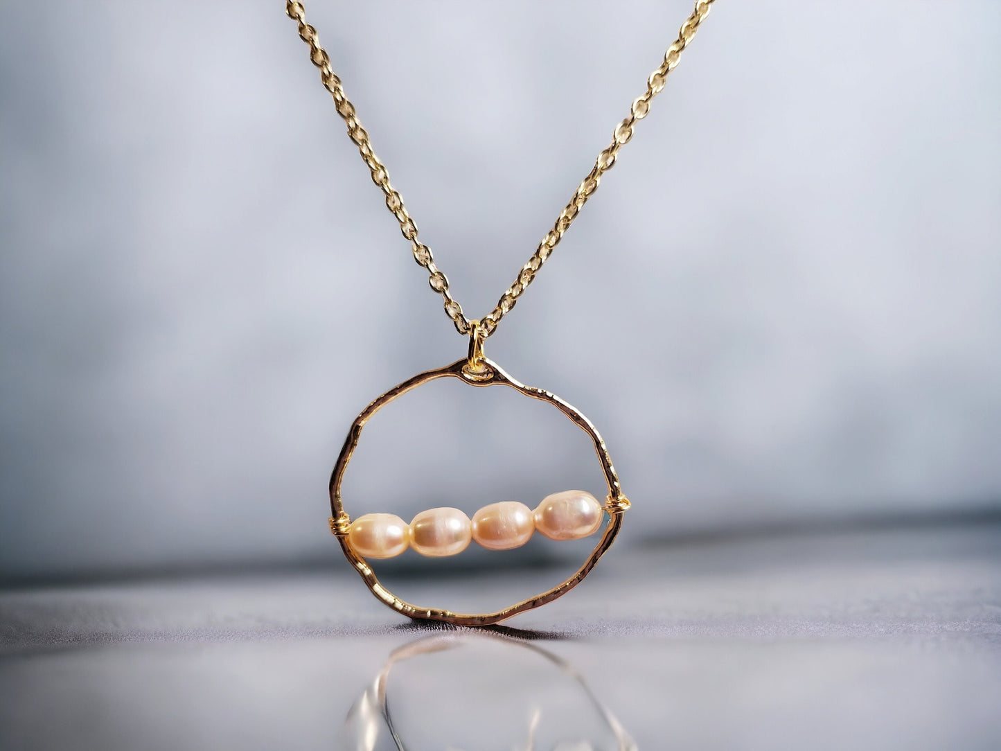 Freshwater cultured peach pearl necklace 6-7mm set on gold circle pendant