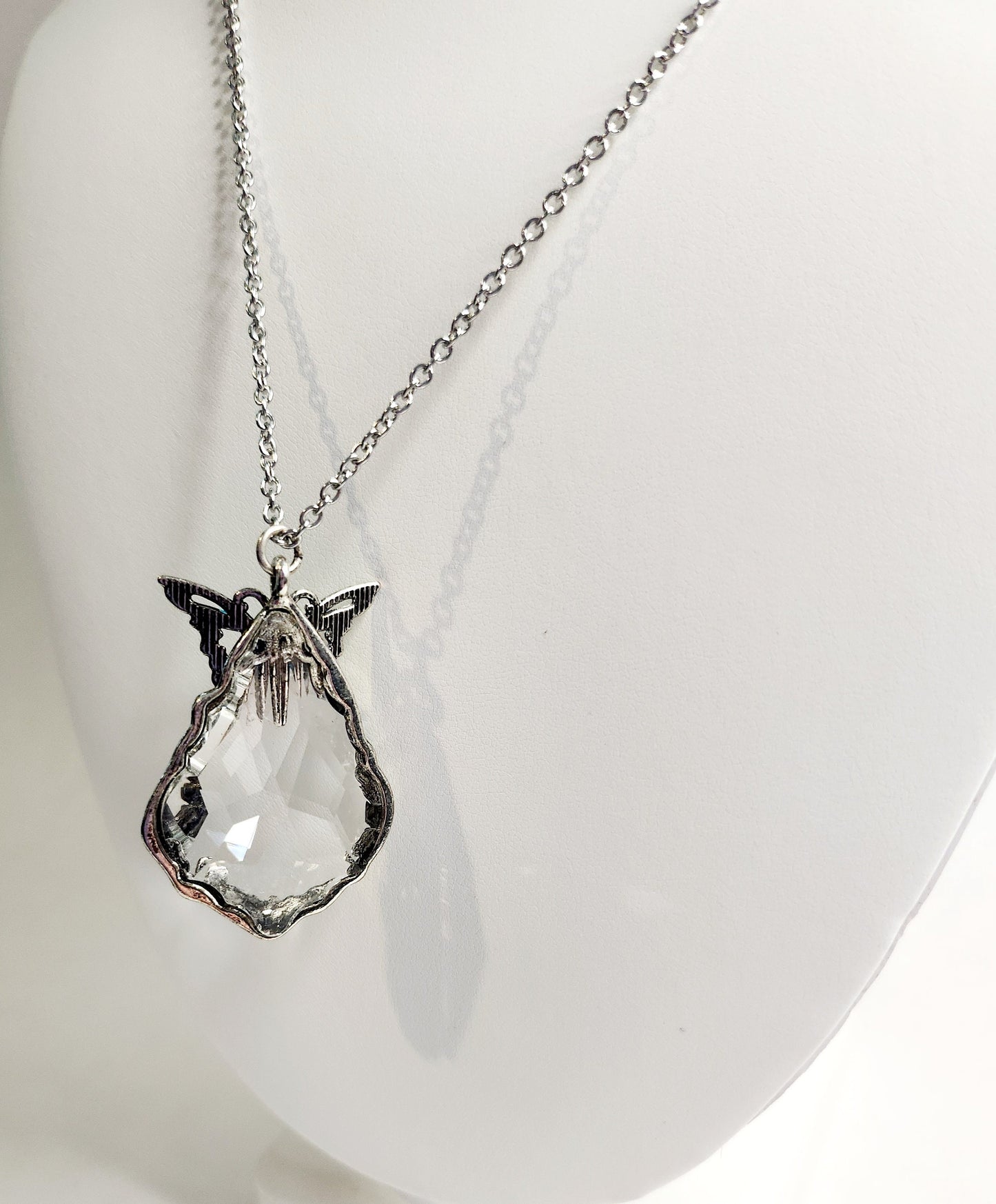 Cut Crystal Pendant in "pewter" with blue enamel butterfly in silver