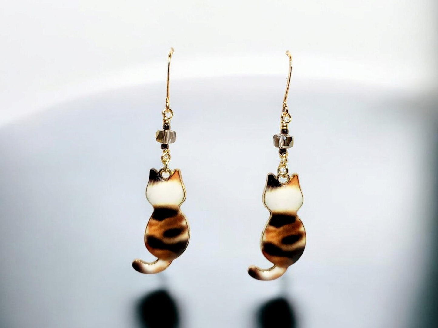 Brown Calico charm dangle earrings with gray glass beading