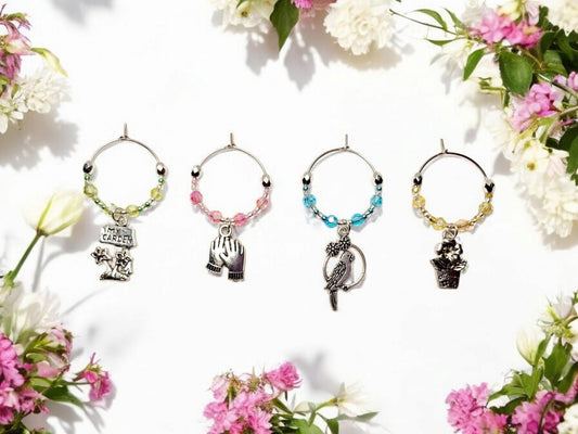 Garden themed wine charms, set of 4 on silver plated holders, in pastel green, yellow, pink and blue.