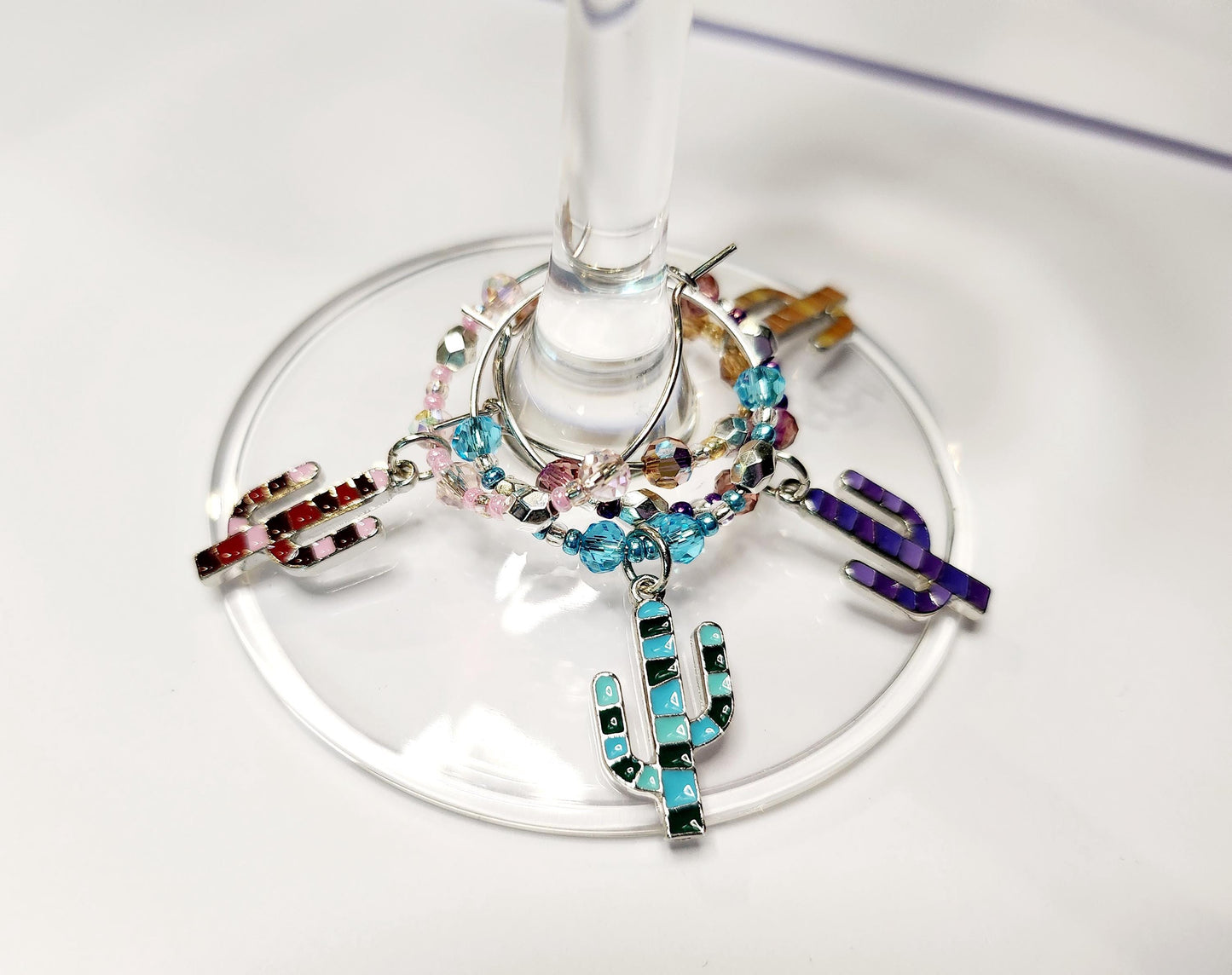 Colorful Enamel Cactus Wine Charms in pink, purple, orange and blue with crystal embelishments