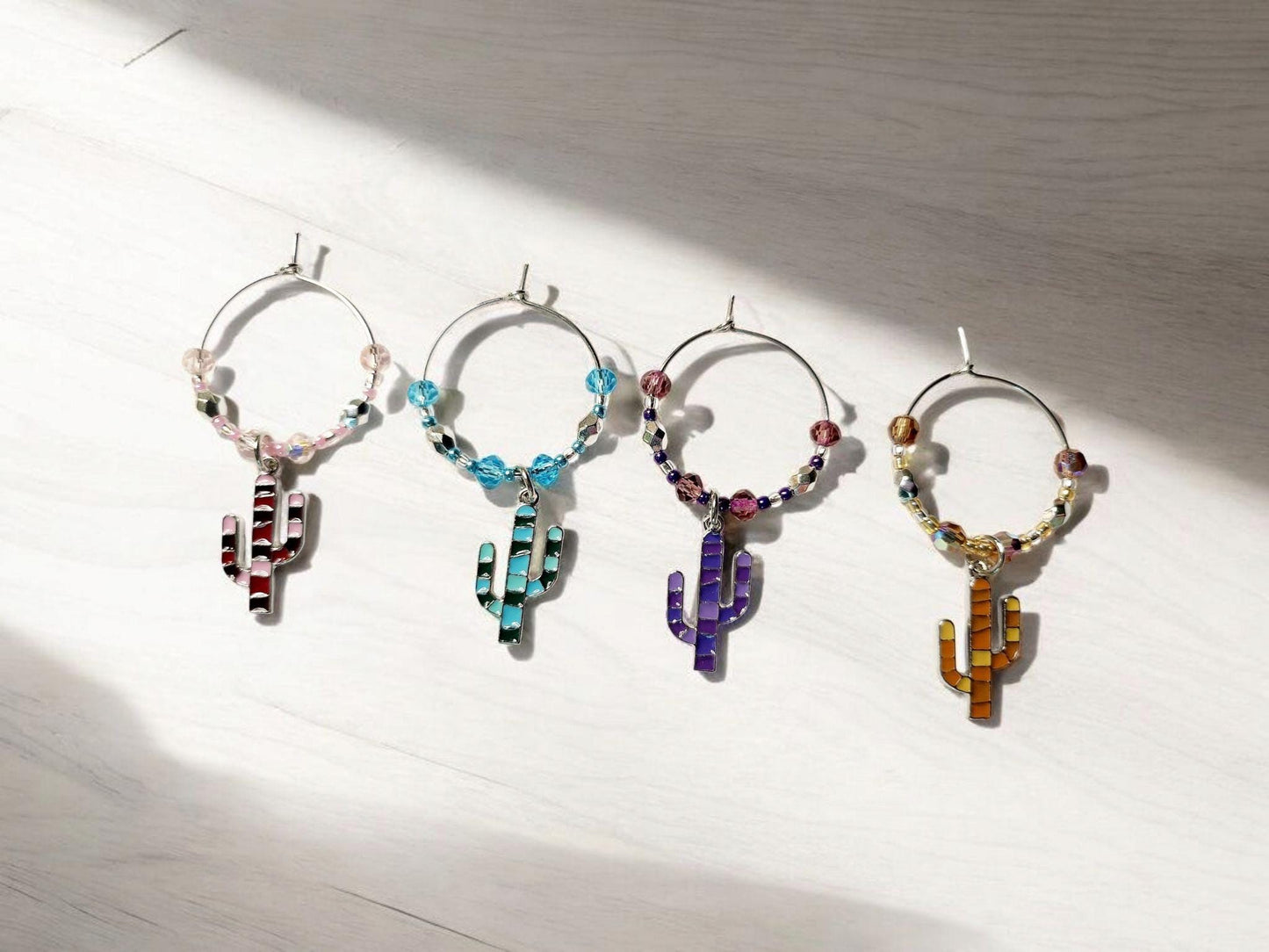 Colorful Enamel Cactus Wine Charms in pink, purple, orange and blue with crystal embelishments