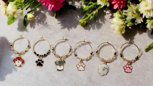Dog wine charms with crystal embellishments-Set of 6 gold plated wine charms with three dogs and three paw prints.