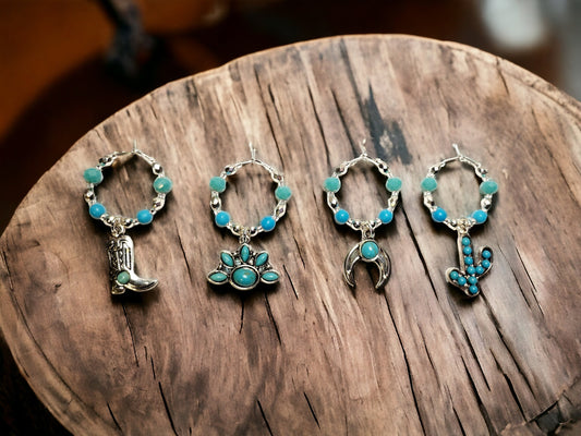 Southwestern themed handmade wine charms in silver and turquoise manganese beading.