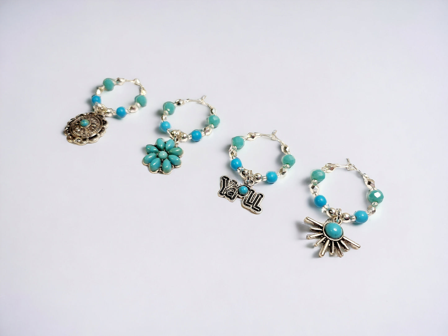 Southwestern themed handmade wine charms in silver and turquoise manganese beading.