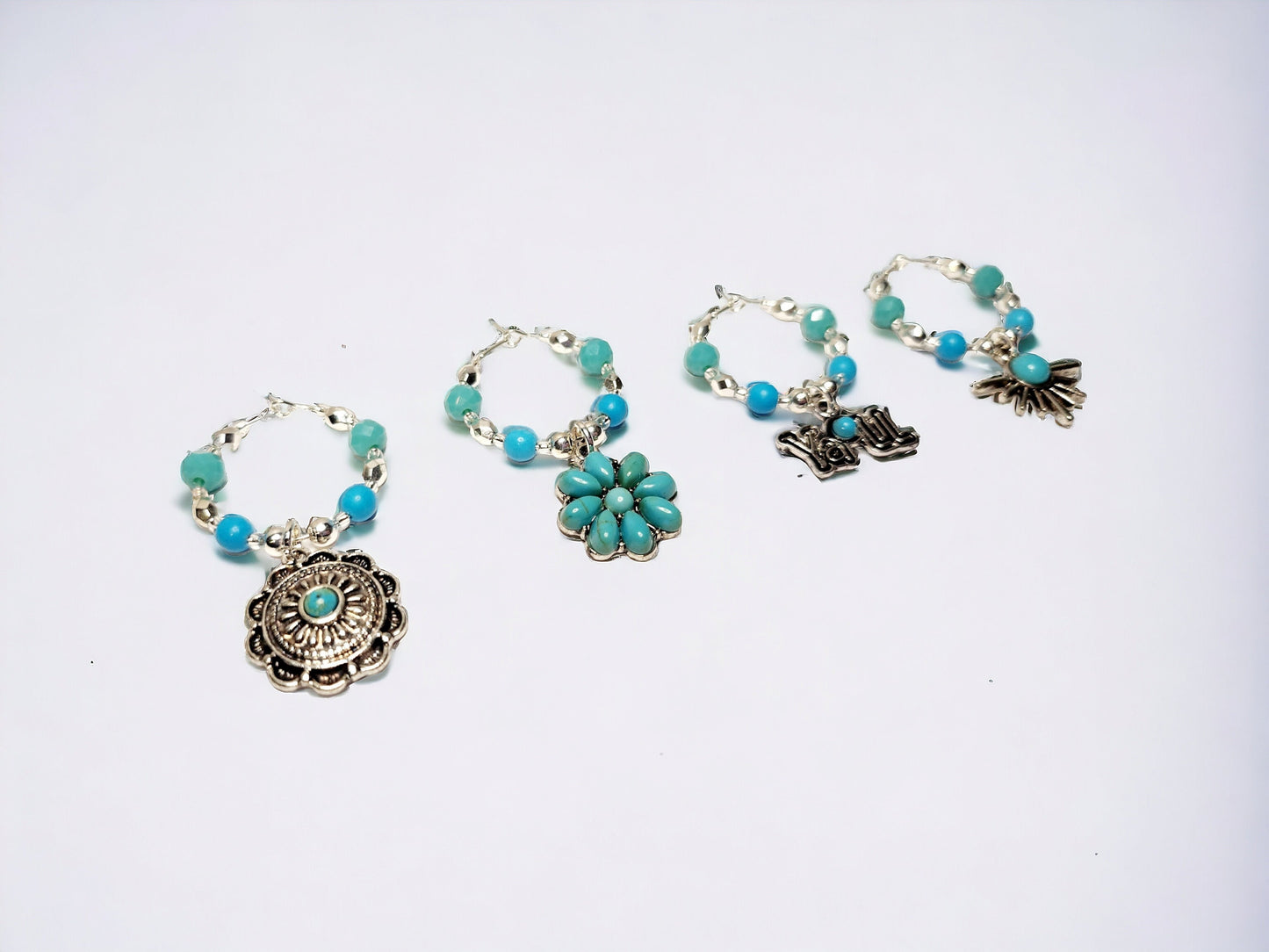 Southwestern themed handmade wine charms in silver and turquoise manganese beading.