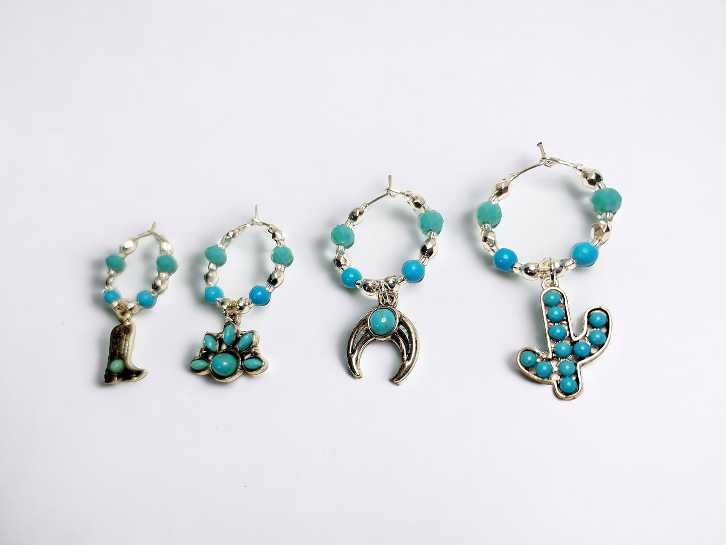 Southwestern themed handmade wine charms in silver and turquoise manganese beading.