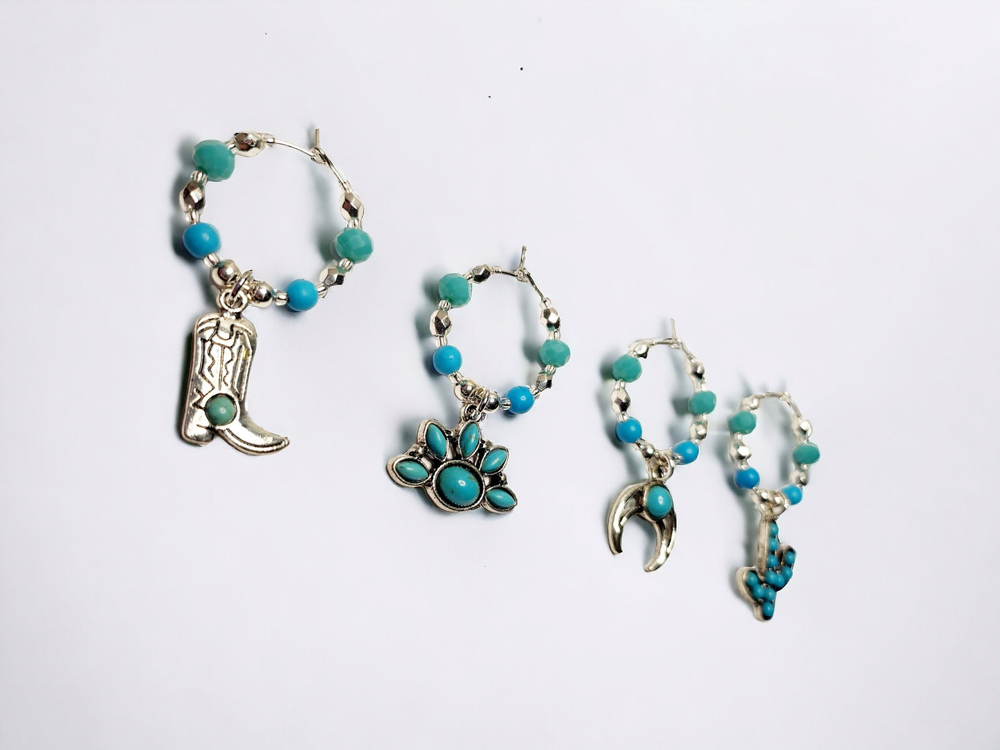 Southwestern themed handmade wine charms in silver and turquoise manganese beading.