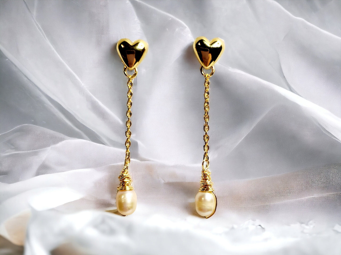 Freshwater Peach Pearls drop earrings on gold hearts
