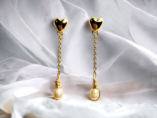 Freshwater Peach Pearls drop earrings on gold hearts