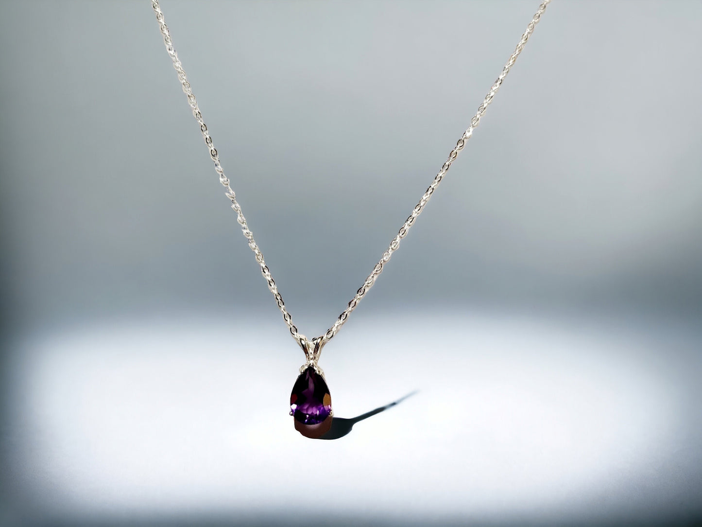 Natural Amethyst Pear shaped pendant 10x7mm set in sterling silver, with 16 inch sterling silver chain