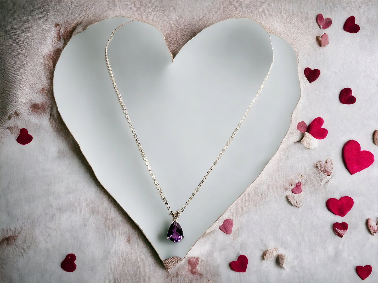 Natural Amethyst Pear shaped pendant 10x7mm set in sterling silver, with 16 inch sterling silver chain