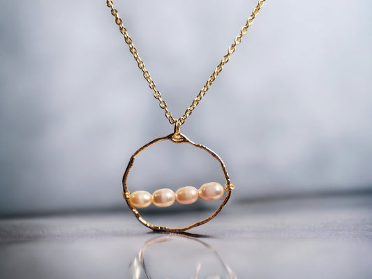 Freshwater cultured peach pearl necklace 6-7mm set on gold circle pendant
