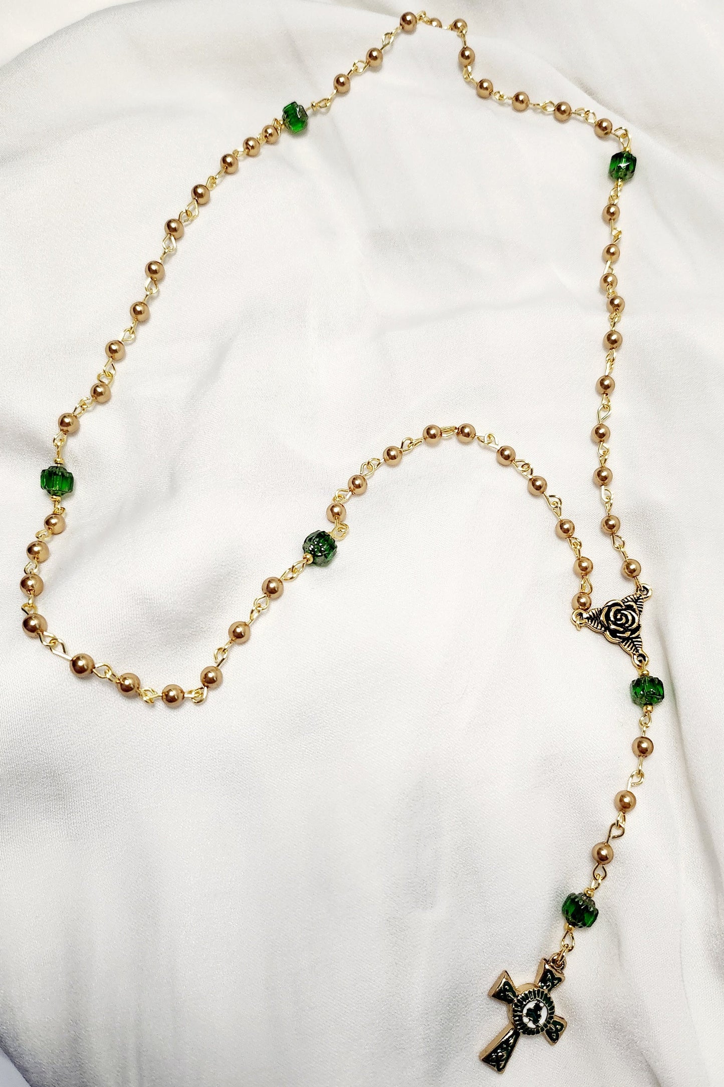 Handmade Gold and Green czech glass beaded rosary with gold trinity rose connector and white, green and gold enameled Celtic cross.