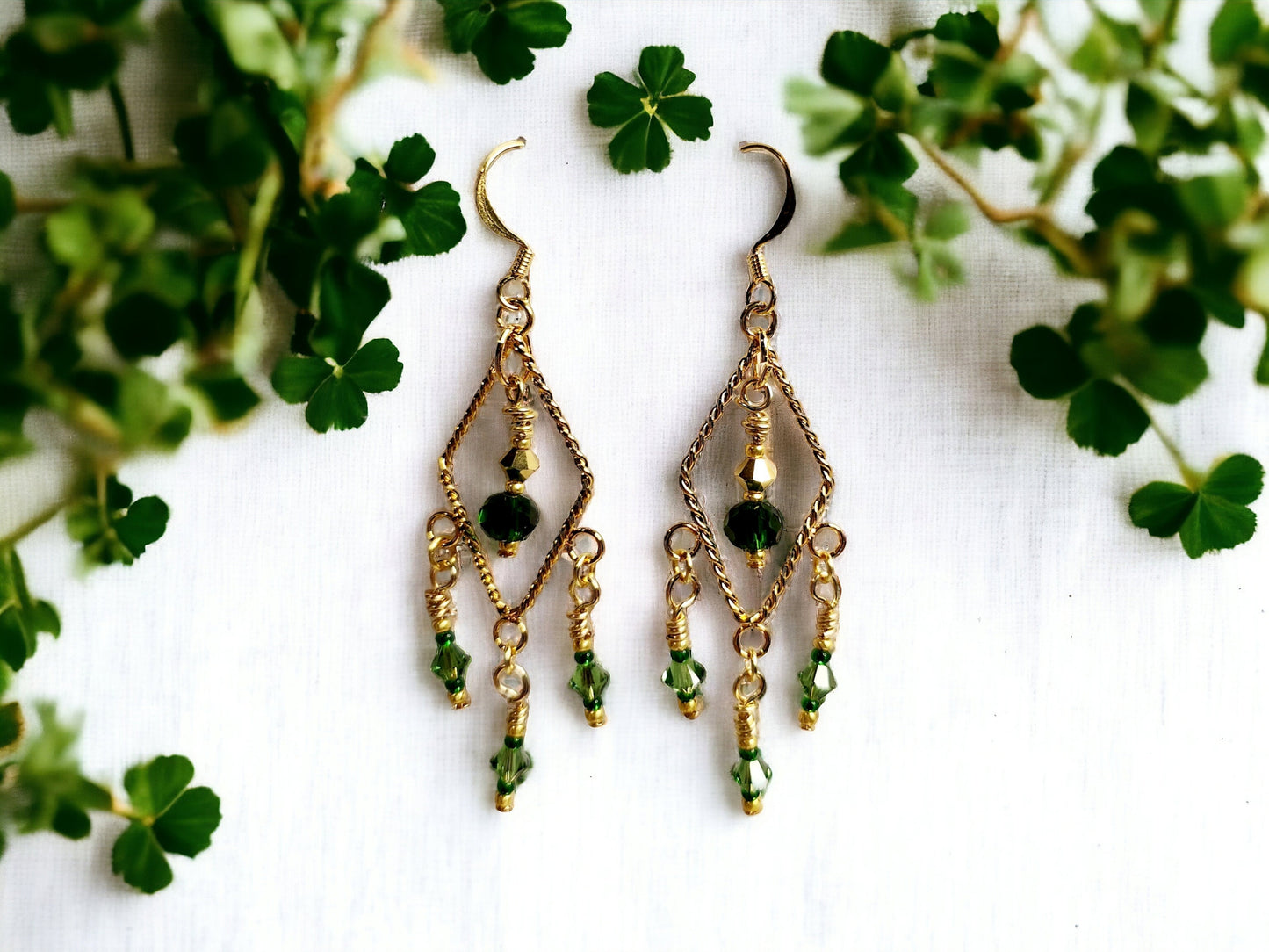 Gold twisted triangle chandelier earrings with emerald beading