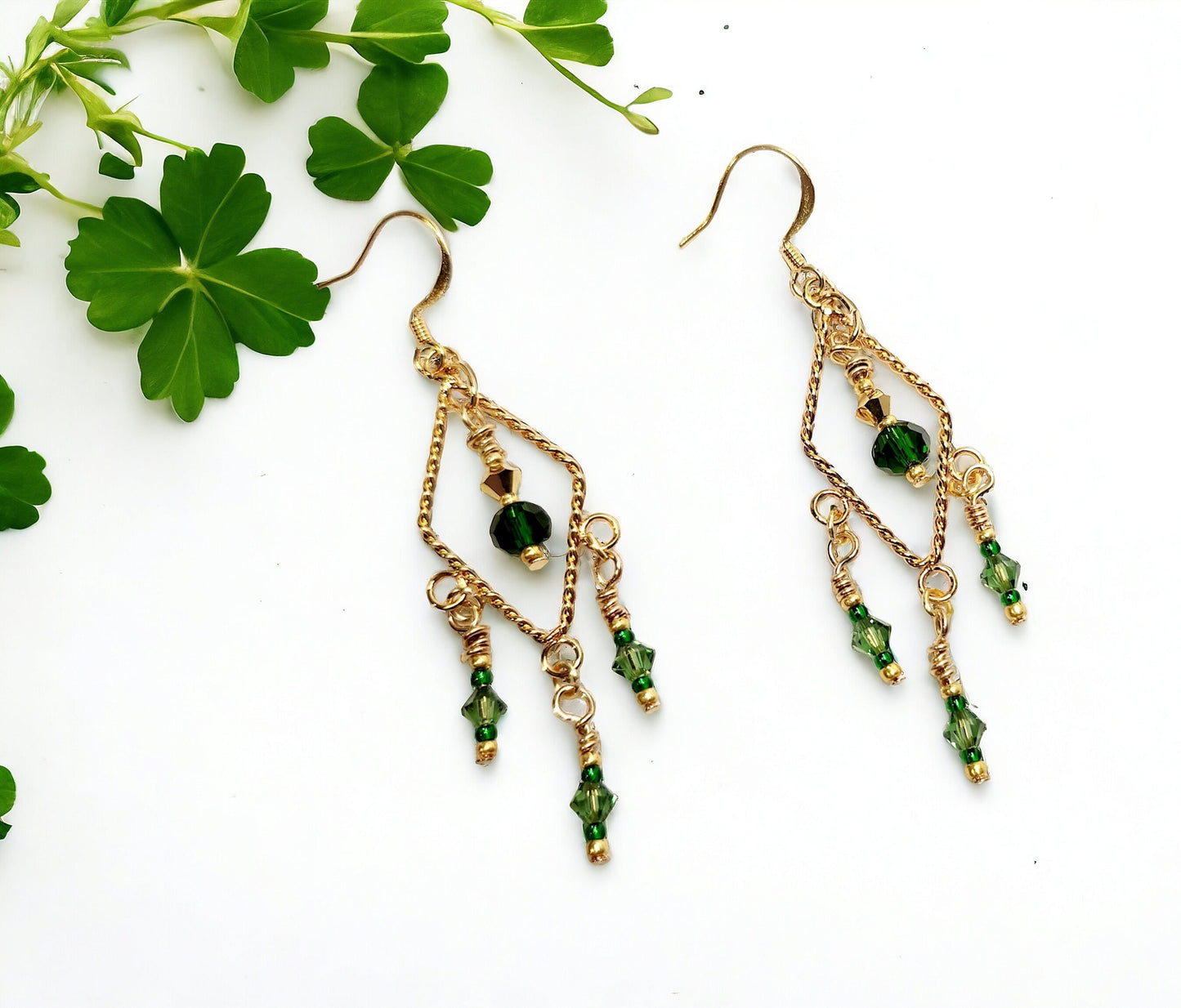 Gold twisted triangle chandelier earrings with emerald beading