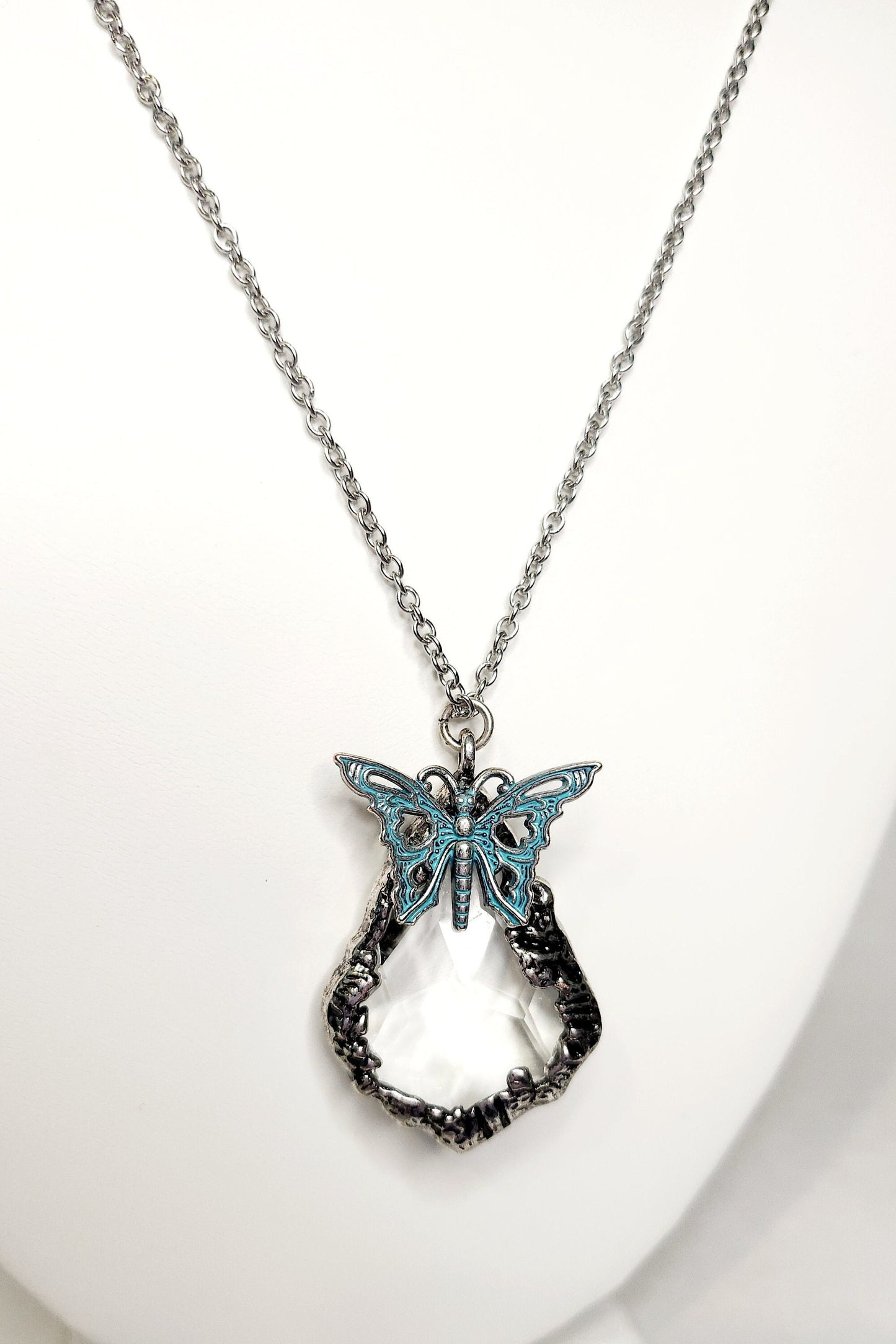 Cut Crystal Pendant in "pewter" with blue enamel butterfly in silver