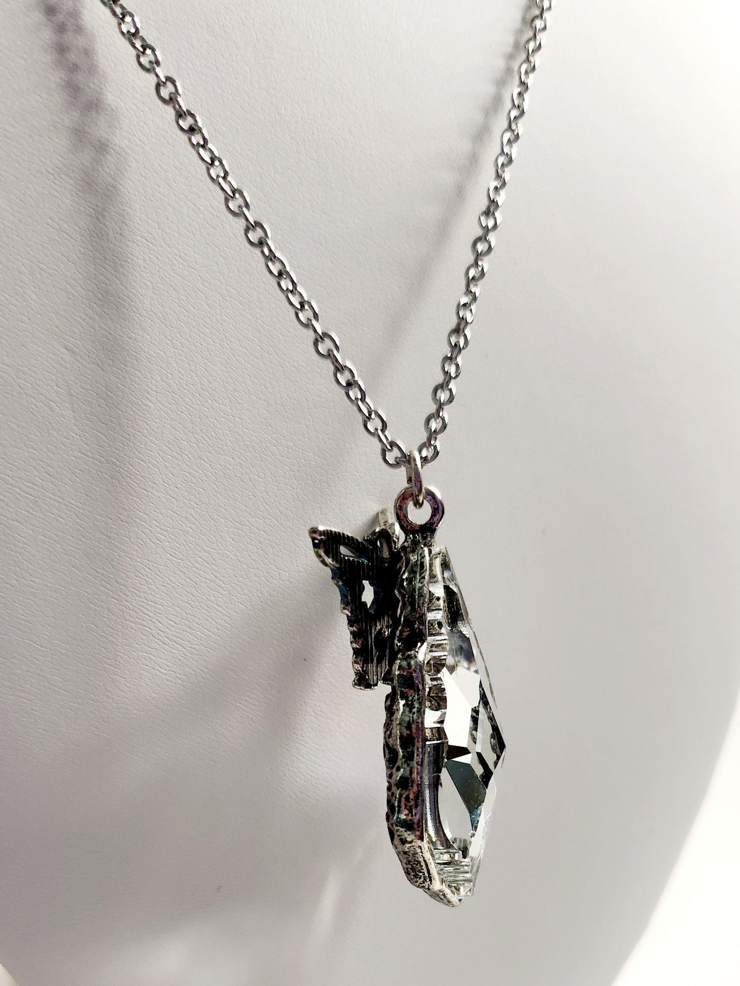 Cut Crystal Pendant in "pewter" with blue enamel butterfly in silver