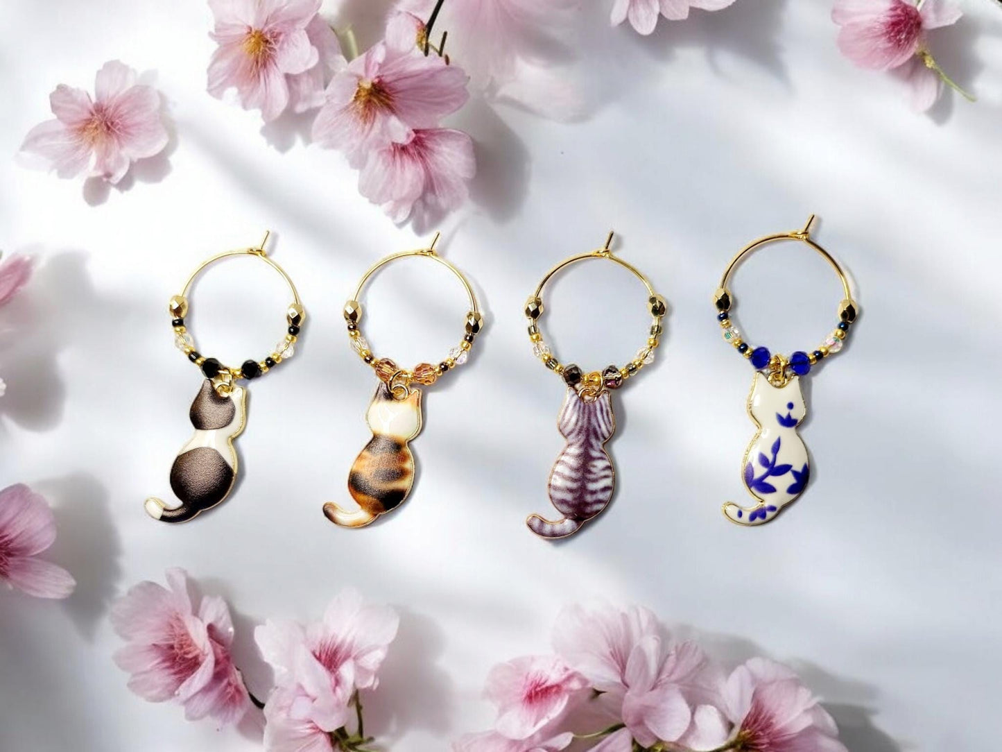 Cat wine charms with crystal embellishments-Set of 4 gold plated wine charms with a calico, tabby, blk/white and blue/wht porcelain designs