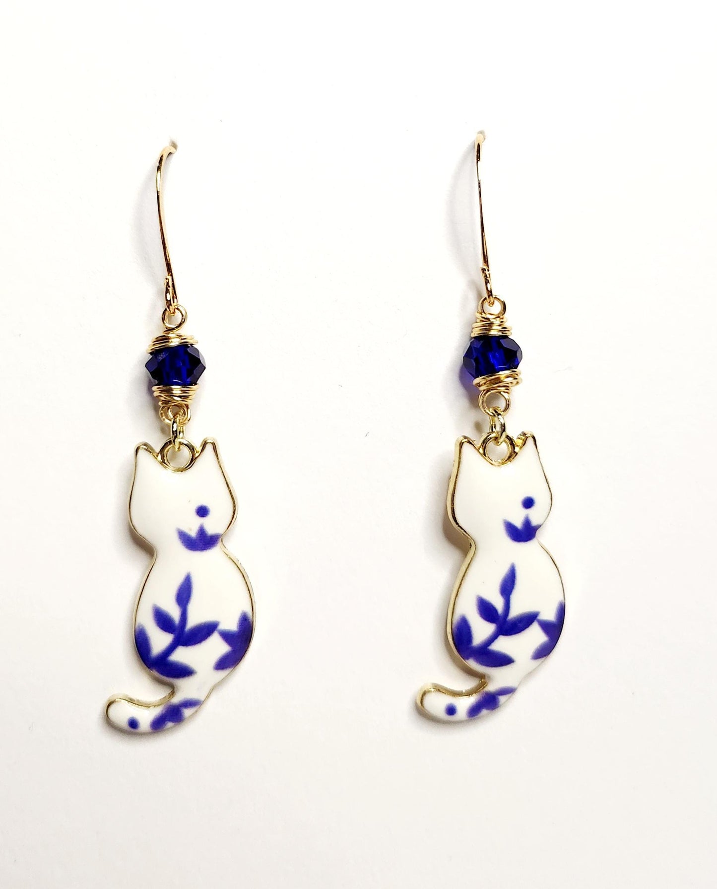 White and blue porcelian themed cat charm dangle earrings with blue beading