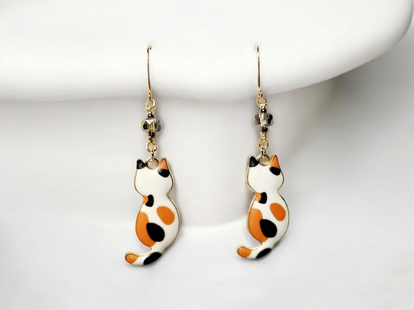 Orange Calico charm dangle earrings with gray glass beading