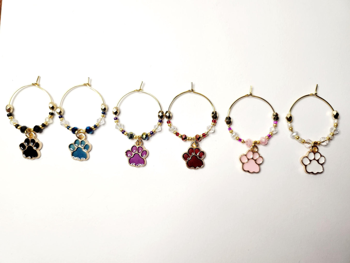 Paw print wine charms with crystal embellishments-Set of 6 gold plated wine charms in black, blue, purple, red, pink and white.