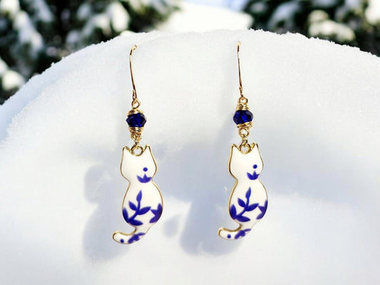 White and blue porcelian themed cat charm dangle earrings with blue beading