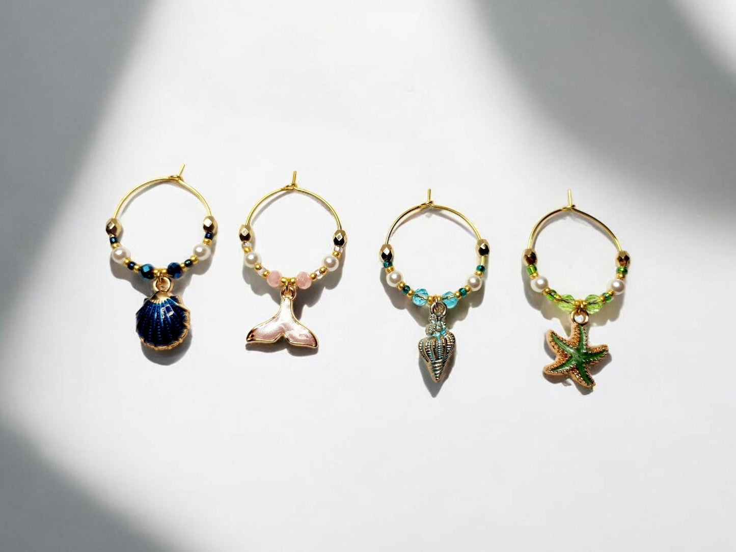 Mermaid Ocean theme enamel Wine charms, set of 4 in of blue, pink, light blue and green.