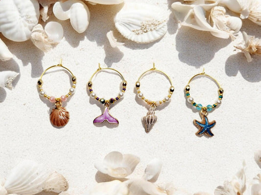 Mermaid Ocean theme enamel Wine charms, set of 4 in of salmon pink, purple, white and blue.