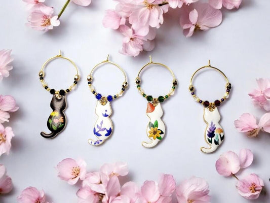 Cat wine charms with crystal embellishments-Set of 4 gold plated wine charms with different painted floral designs on each.
