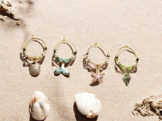 Mermaid Ocean theme enamel Wine charms, set of 4 in pastels white, blue, pink and green on gold plated holders.