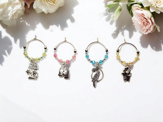 Garden themed wine charms, set of 4 on silver plated holders, in pastel green, yellow, pink and blue.