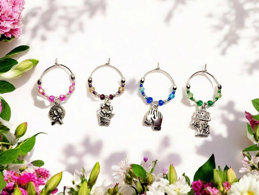 Garden themed wine charms, set of 4 on silver plated holders, with crystal beading in pink, purple, blue and green.