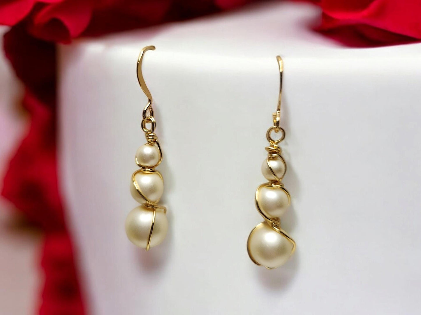 Three pearl and gold handcrafter dangle earrings