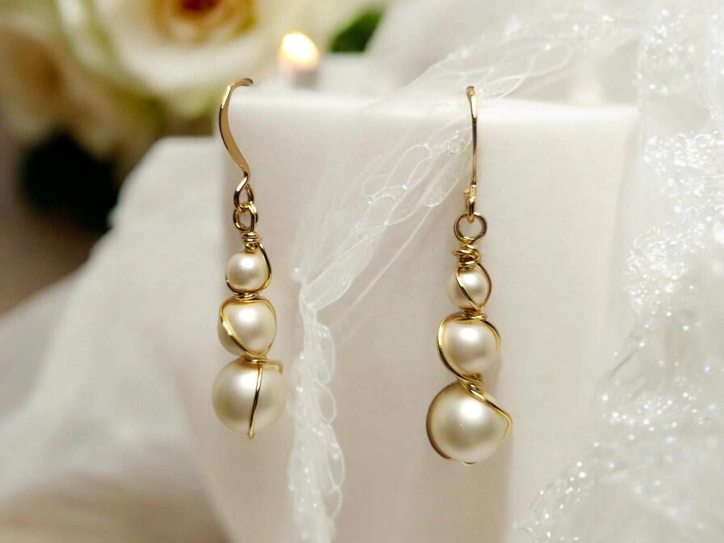 Three pearl and gold handcrafter dangle earrings