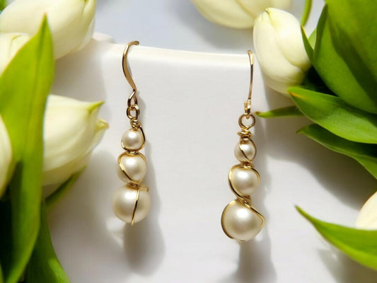 Three pearl and gold handcrafter dangle earrings