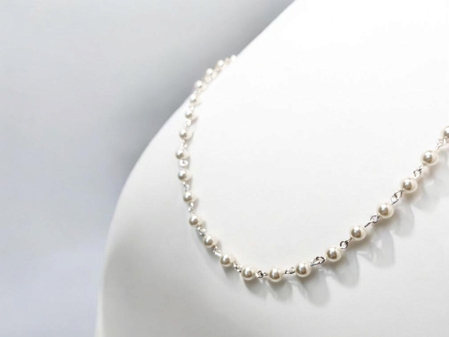 Opera length white crystal pearl necklace with silver links