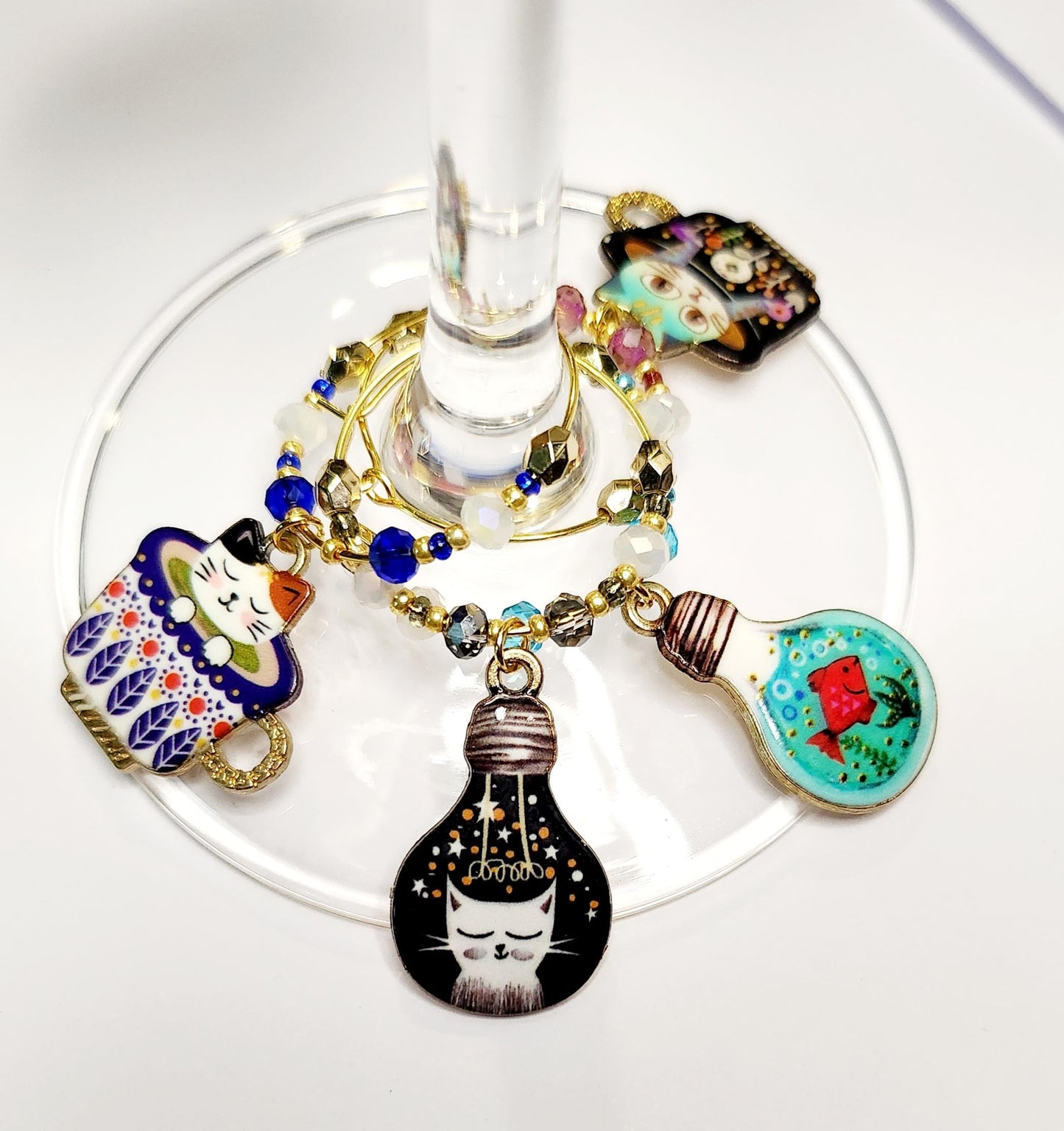 Whimsical Cat wine charms with crystal embellishments-Set of 4 gold plated wine charms in blue, grey, teal and purple crystals.