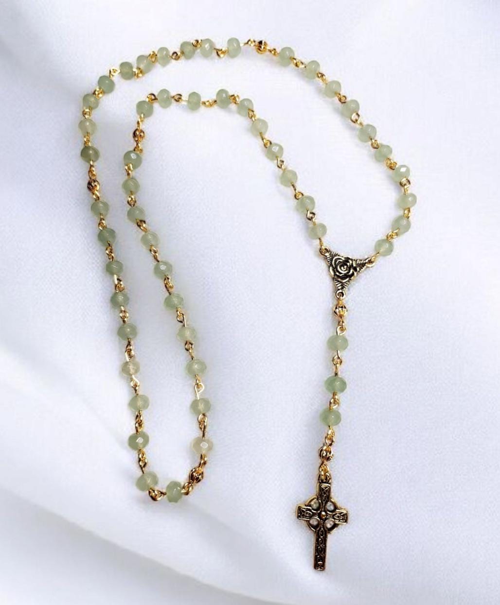 Green aventurine gemstone and gold beaded rosary with gold trinity rose connector and gold Celtic cross.
