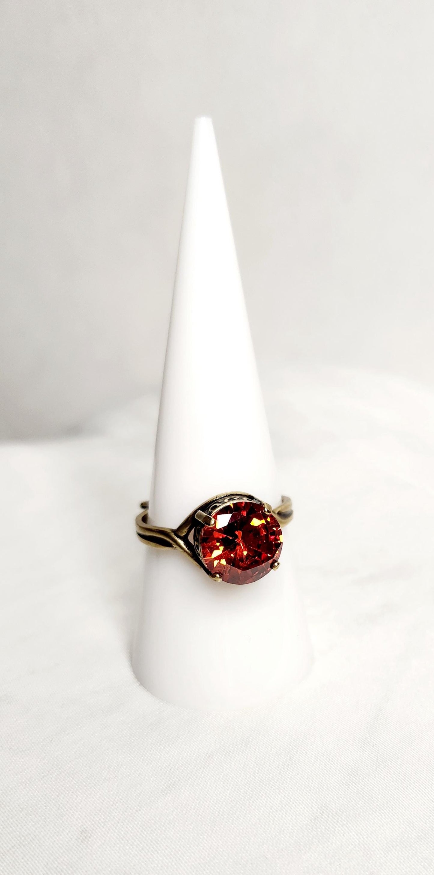 Fire Opal (10mm)set in antiqued bronze crown setting with adjustable band