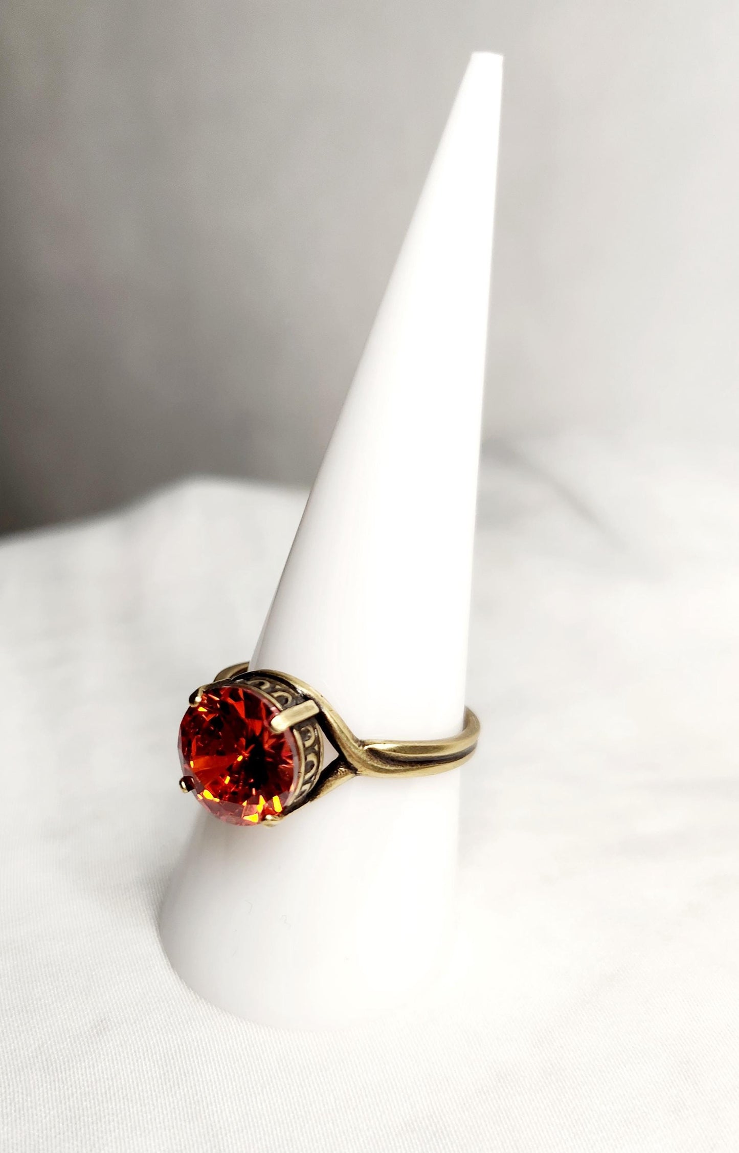 Fire Opal (10mm)set in antiqued bronze crown setting with adjustable band