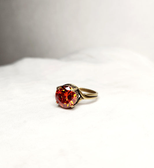 Fire Opal (10mm)set in antiqued bronze crown setting with adjustable band
