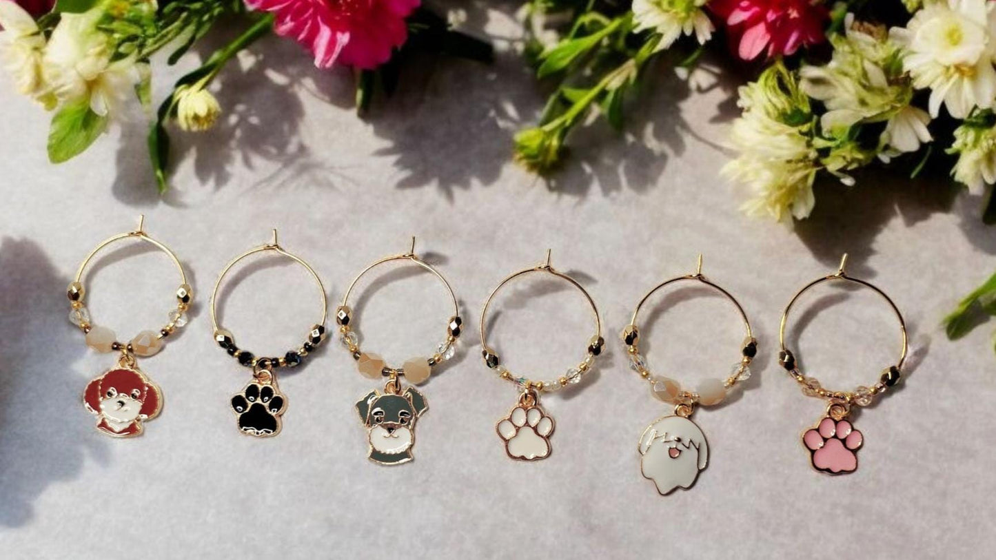 Dog wine charms with crystal embellishments-Set of 6 gold plated wine charms with three dogs and three paw prints.