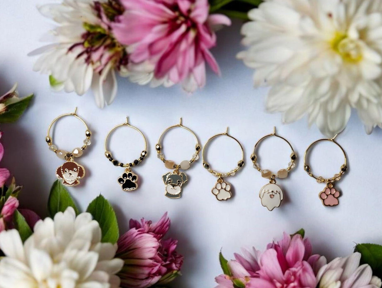 Dog wine charms with crystal embellishments-Set of 6 gold plated wine charms with three dogs and three paw prints.
