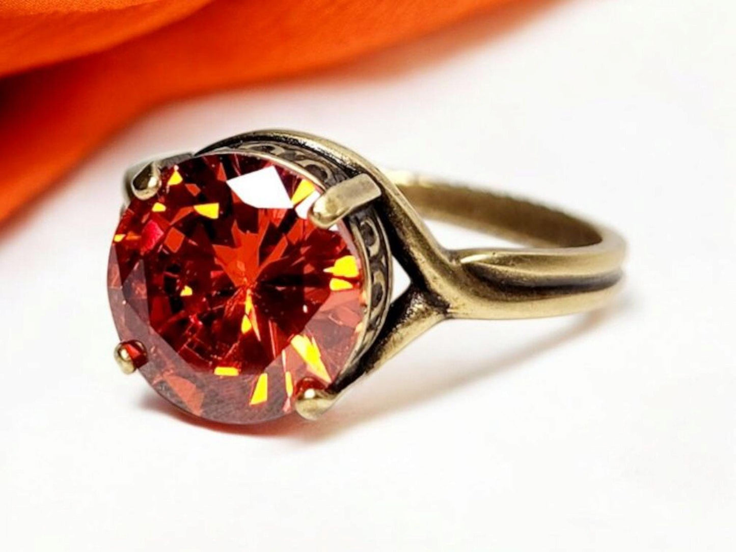 Fire Opal (10mm)set in antiqued bronze crown setting with adjustable band