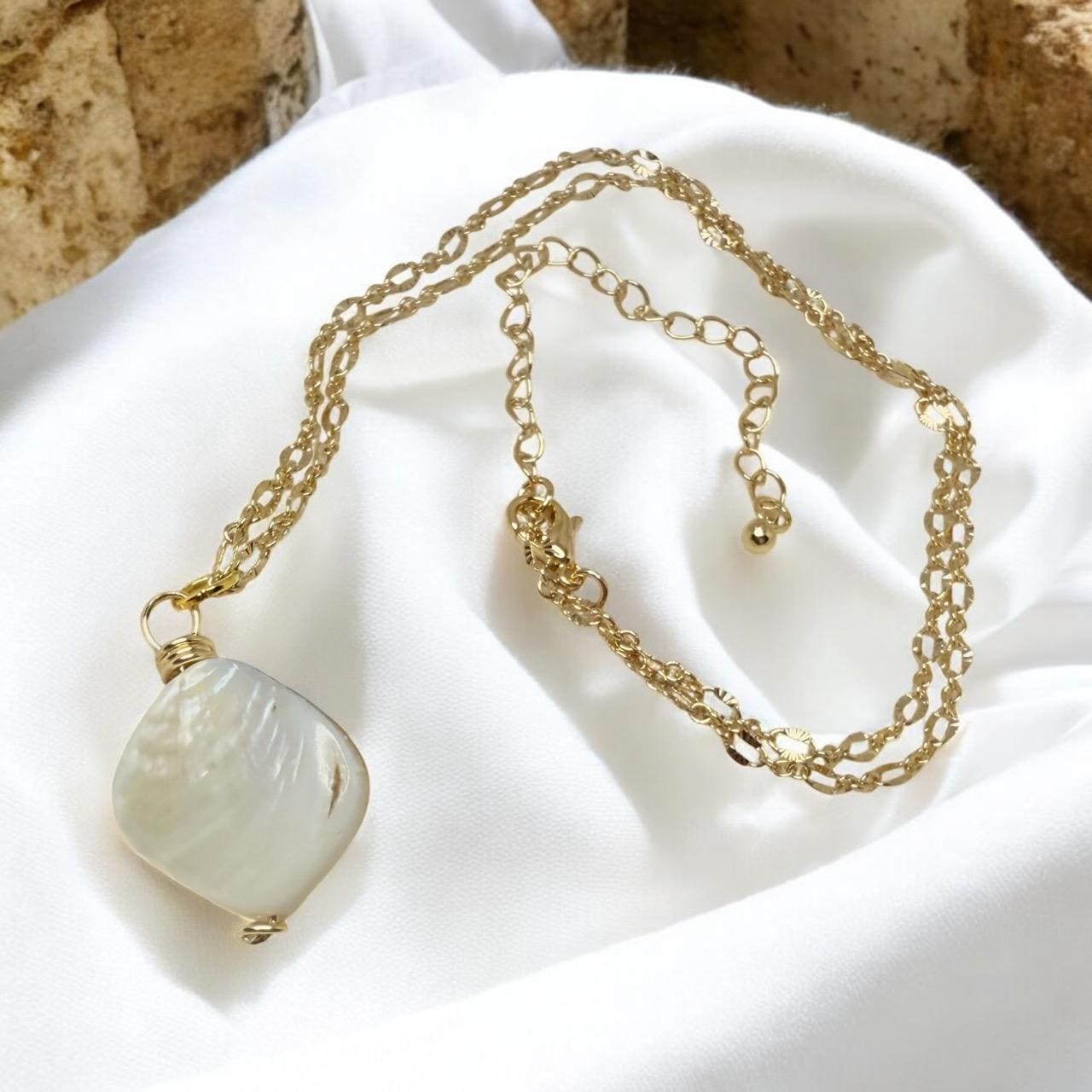 Stunning White Oyster Shell Pendant set on oval gold faceted pendant, 18 inches