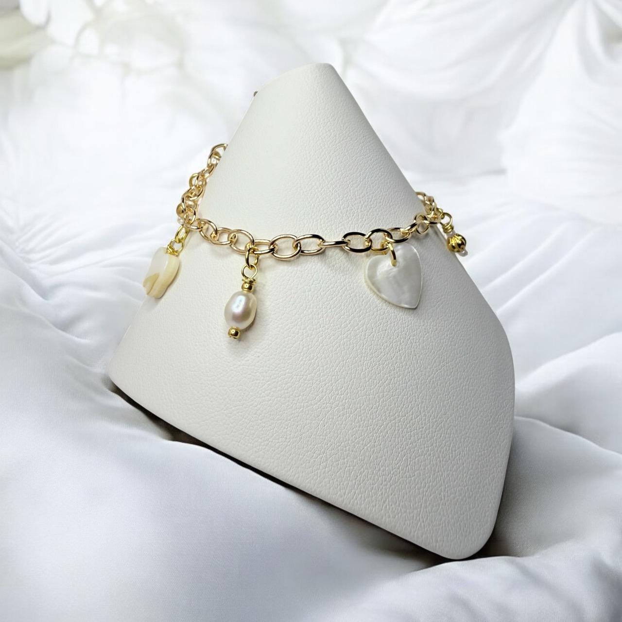 Mother of Pearl Charms and Natural pearls set on gold tone charm bracelet