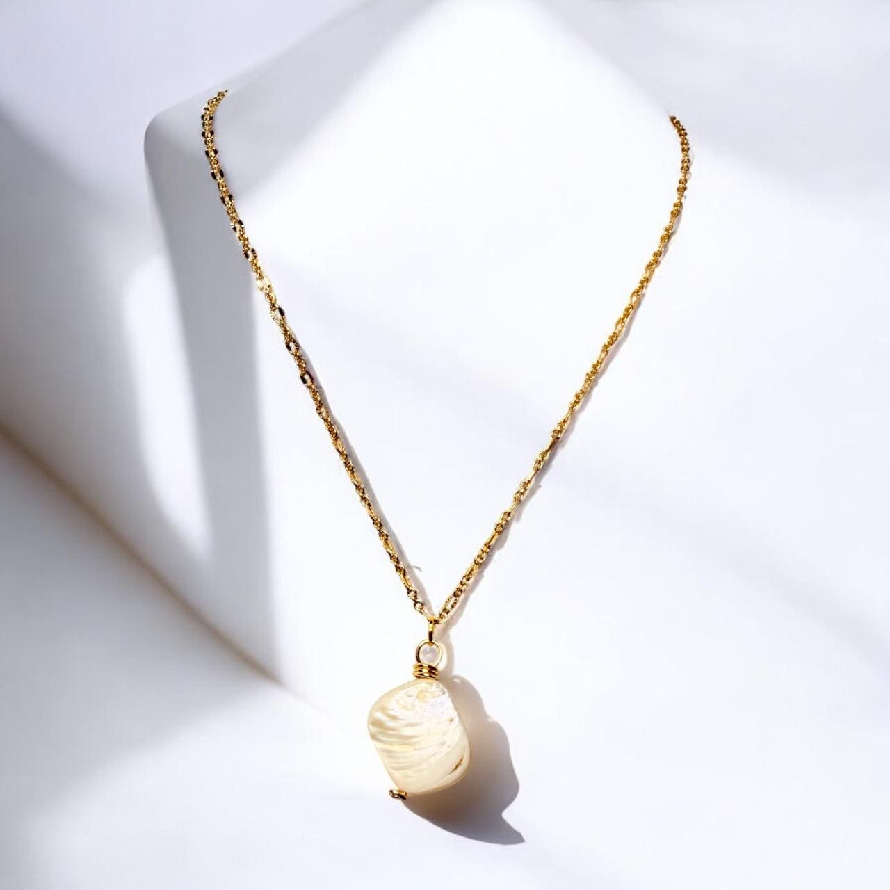 Stunning White Oyster Shell Pendant set on oval gold faceted pendant, 18 inches