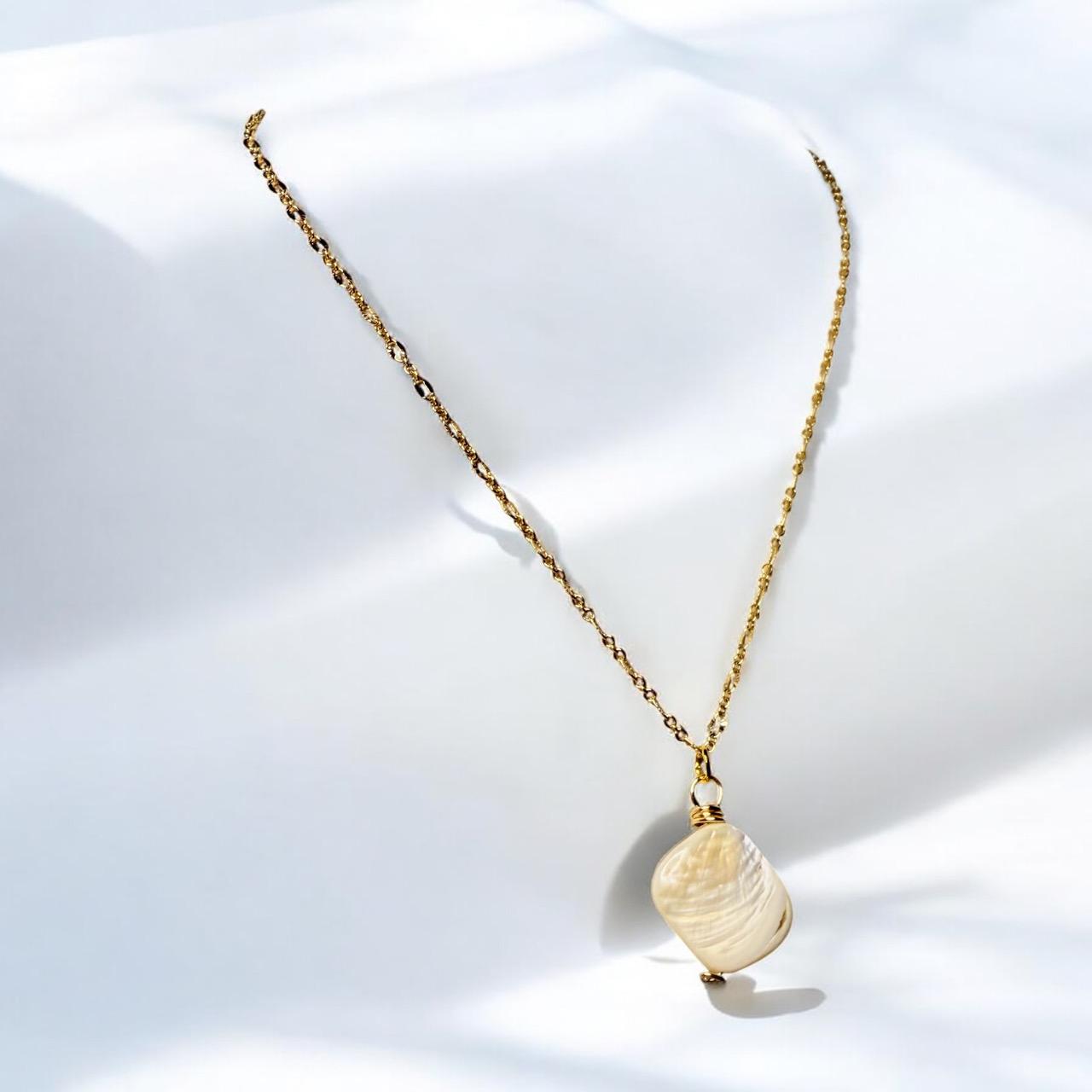 Stunning White Oyster Shell Pendant set on oval gold faceted pendant, 18 inches