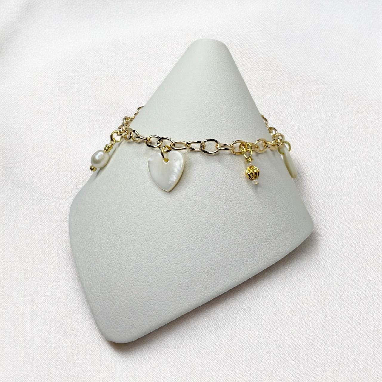 Mother of Pearl Charms and Natural pearls set on gold tone charm bracelet